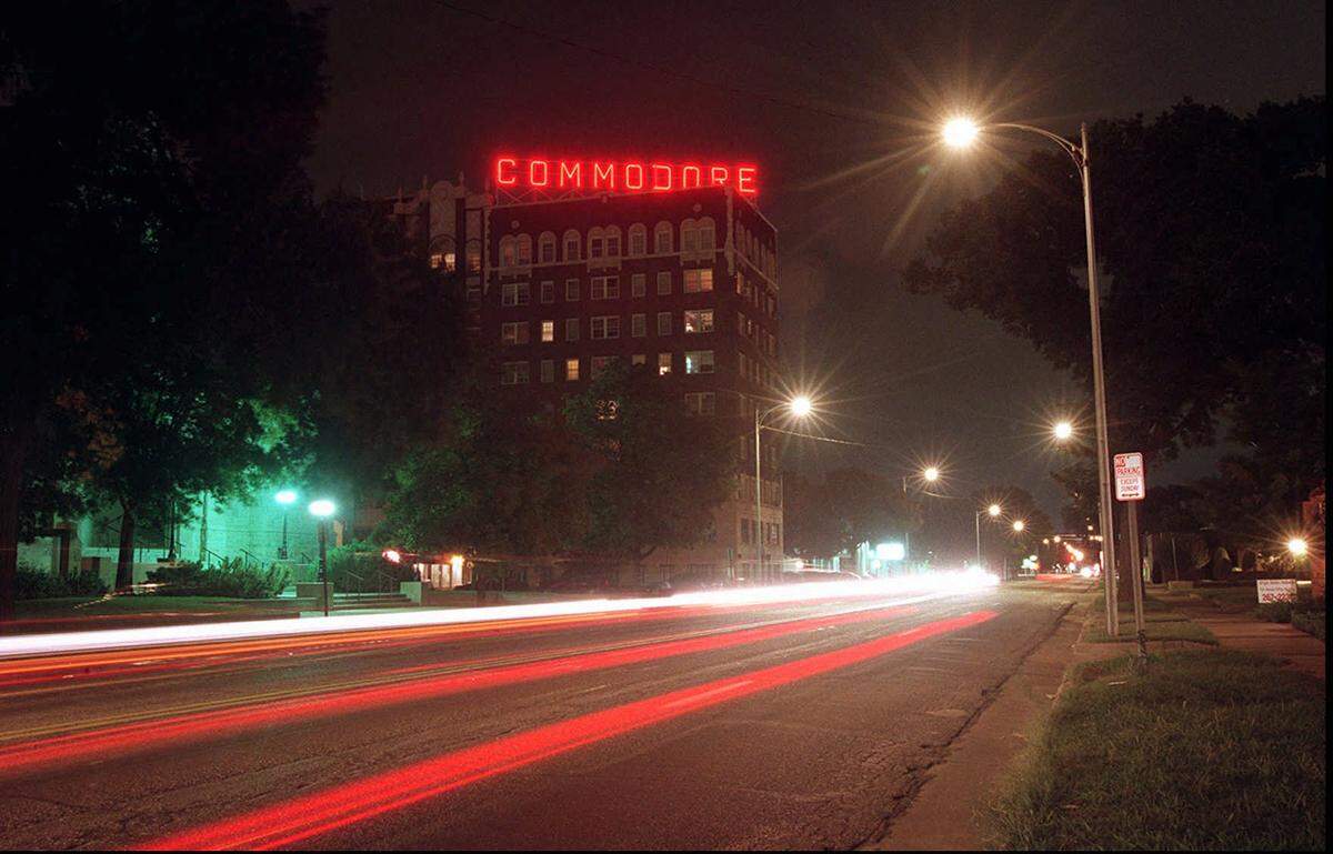This time-lapse photo from 1997 shows the Commodore sign lit on North Broadway and car lights below it. The neon sign hasn’t been illuminated for some time.