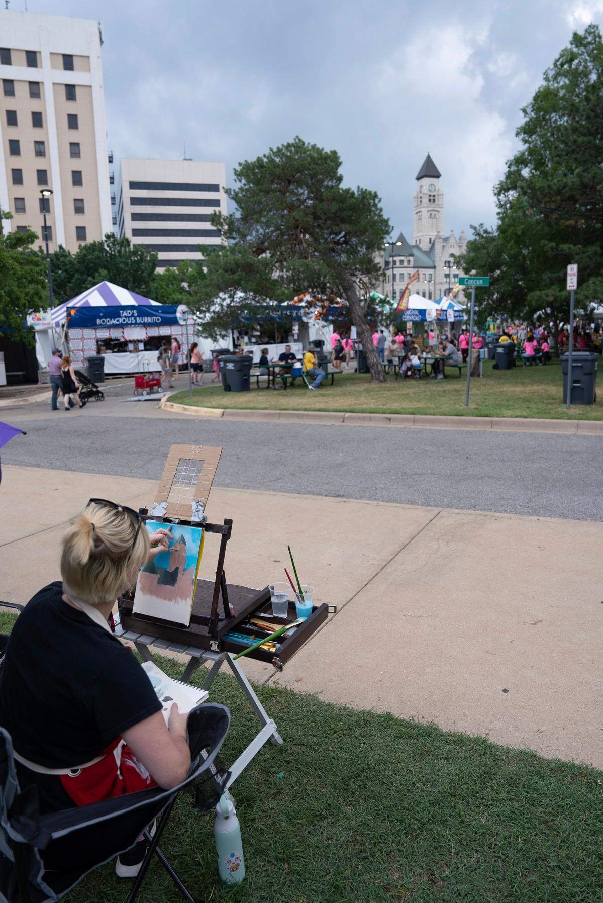 Makayla Troyer paints the Sedgwick County Historical Museum during the Wichita Riverfest’s Plein Air event.