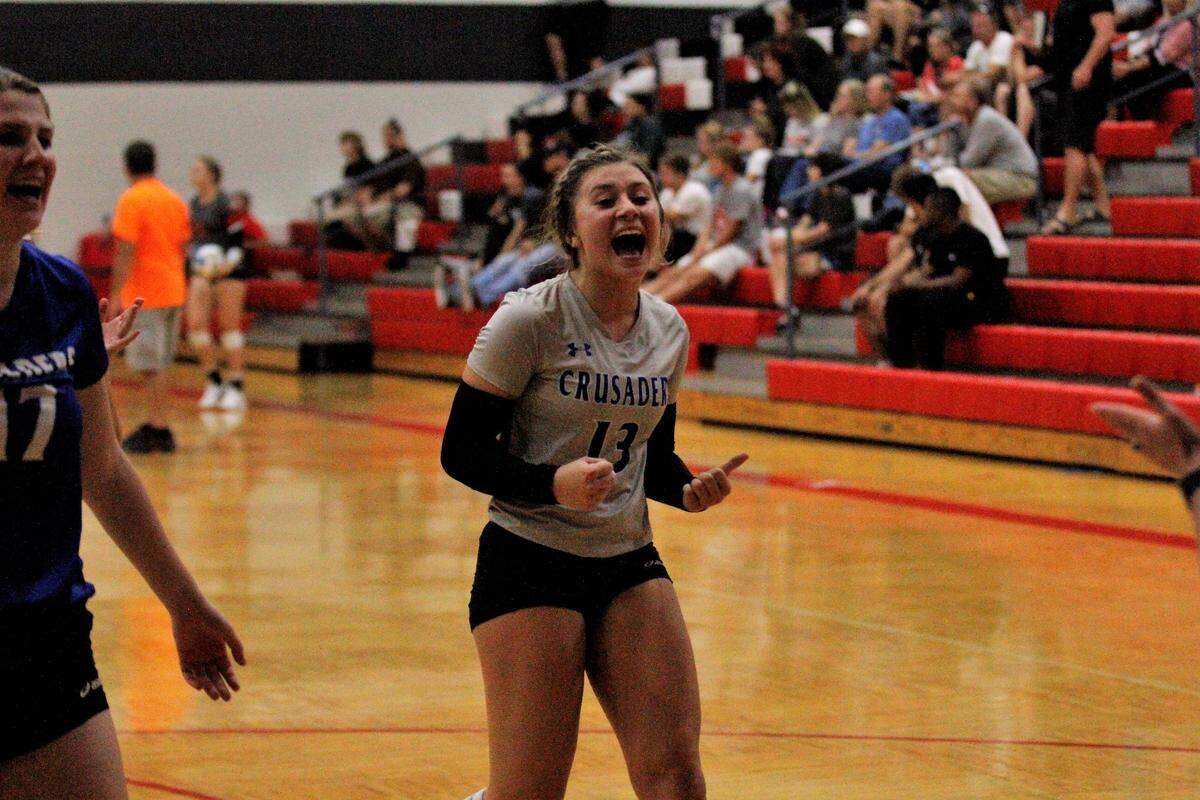 Kapaun junior libero Ryen Wilkens celebrates after the Crusaders’ championship at the Maize Invitational. Kapaun beat Maize South in three sets in the final. (Sept. 15, 2018)