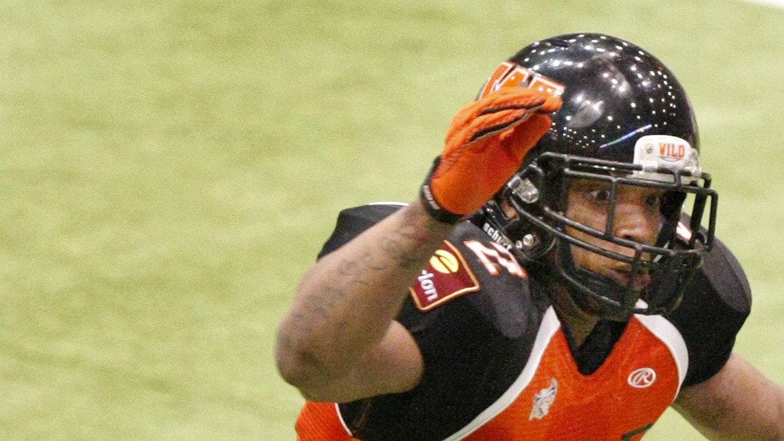 Omaha's Allen Burrell (6) hauls in a pass against the Wild's Corey Stollmeyer, left, in the 2nd quarter  Saturday night at Hartman Arena. (May 14, 2011)