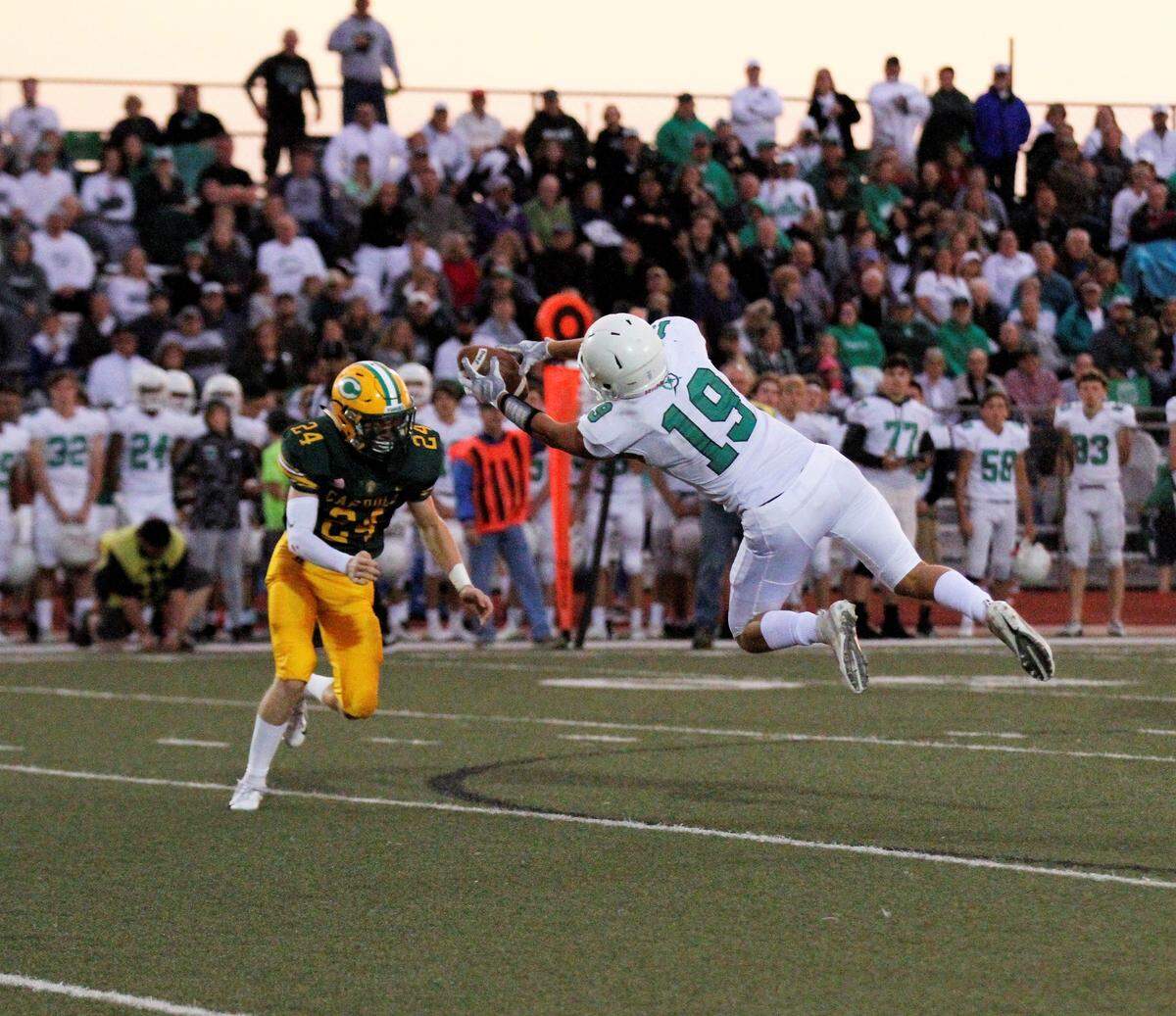 Derby junior receiver Jacob Karsak extends for a catch against Bishop Carroll in the Panthers’ 24-6 road win Friday. (Sept. 21, 2018)