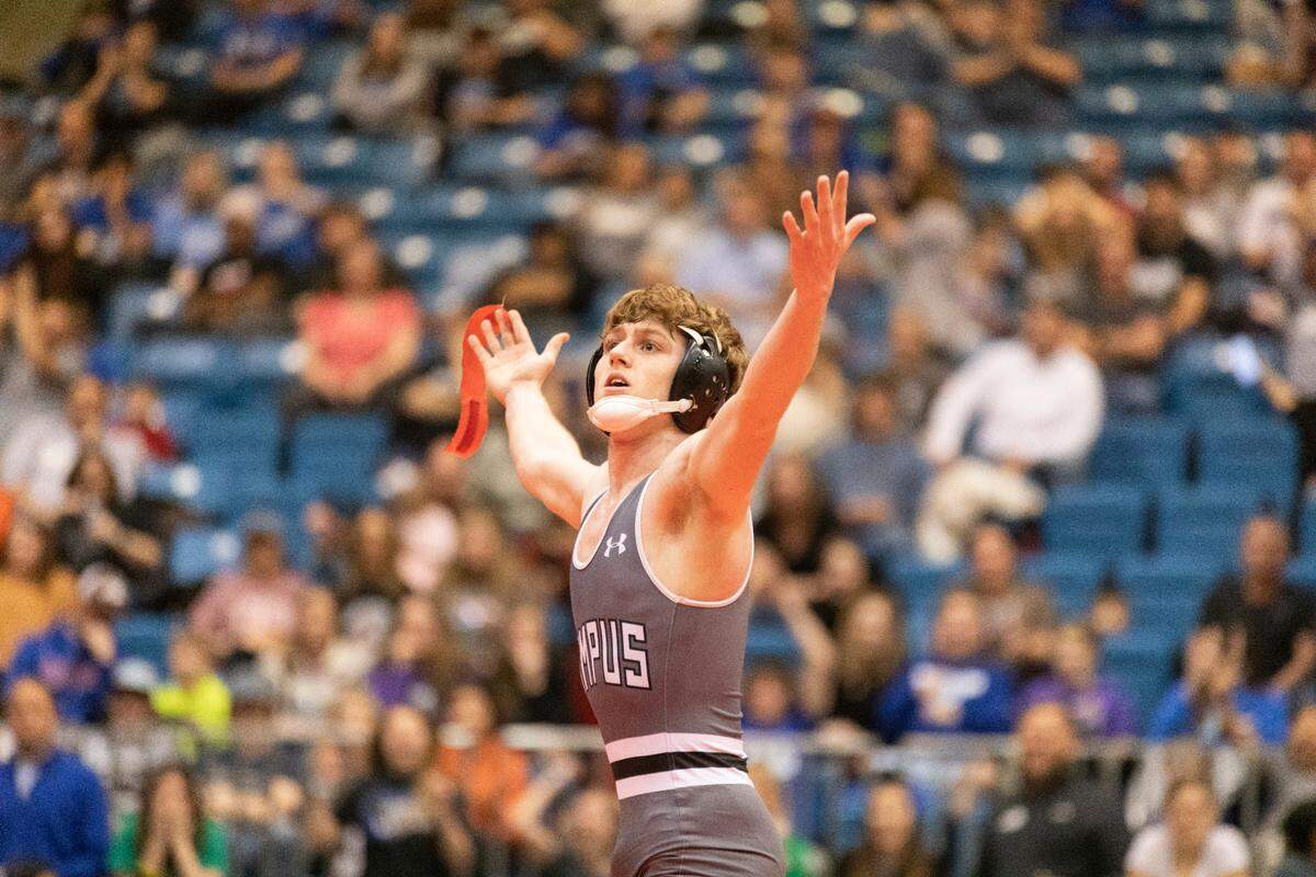 Campus senior Dylan Sheler celebrates his Class 6A state championship after winning for the first time in his final match.