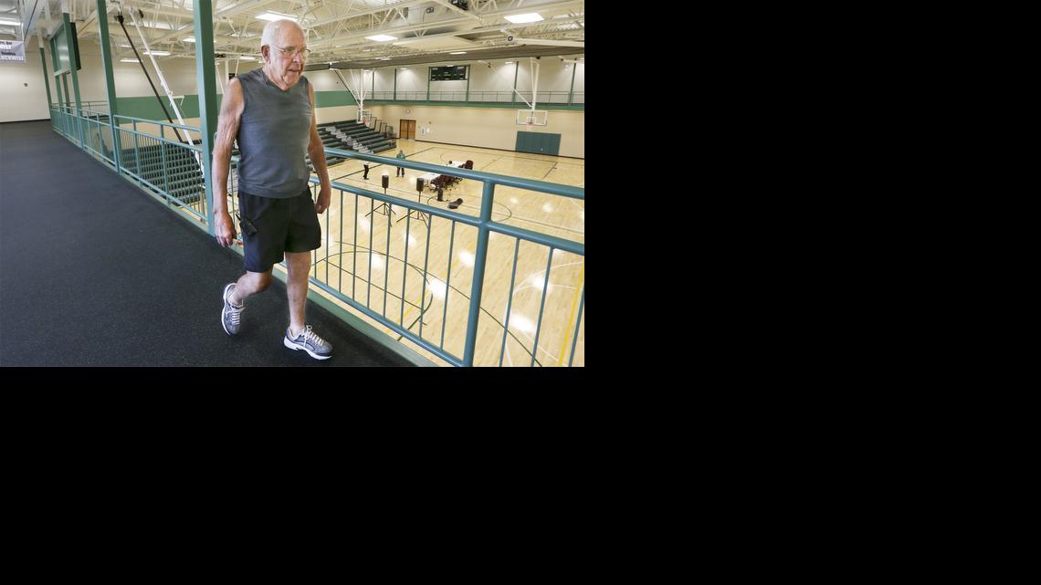 Mulvane resident Dick Johnstone, 85, walks along the track at the Mulvane Recreation Center on Thursday. Some residents are concerned because seniors can use the track while the gym below is used by Mulvane Grade School students.

