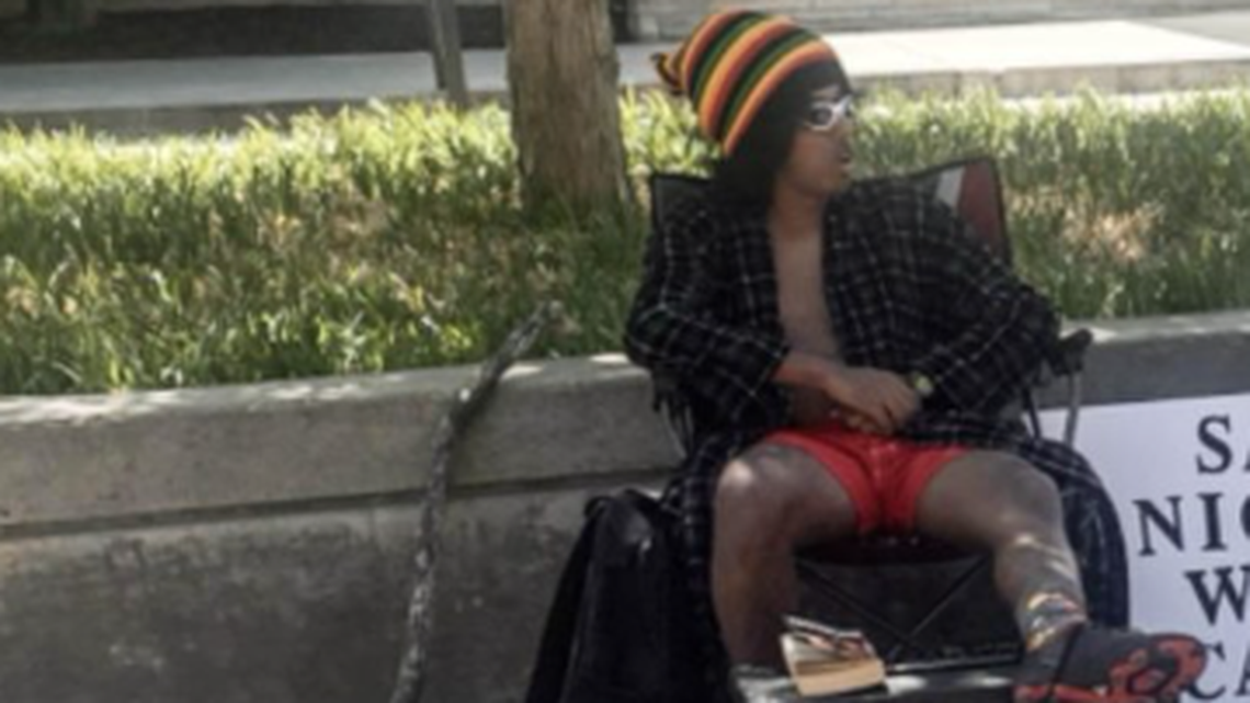 This guy showed up on the campus at Kansas State University in full-body blackface makeup with a sign inviting students to say the N-word and win candy. One did, and got slapped in the face by another student.