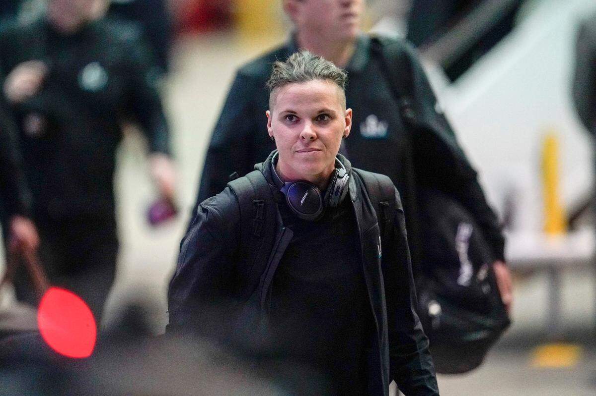 San Francisco 49ers assistant coach Katie Sowers arrives for the NFL Super Bowl 54 football game Sunday, Jan. 26, 2020, at the Miami International Airport in Miami. (AP Photo/David J. Phillip)