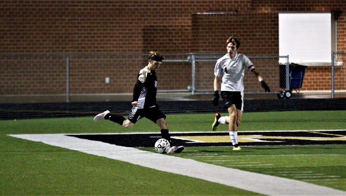 Maize South’s Andrew Bliss sends in a cross during the Mavericks’ 2-1 double overtime win over Eisenhower on Thursday night. (Oct. 25, 2018)