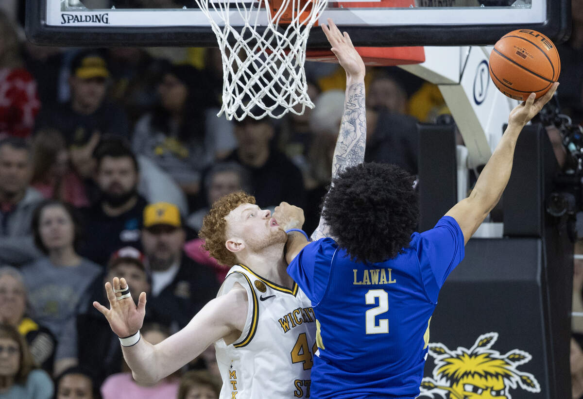 Wichita State’s Will Berg tries to block the shot of Tulsa’s Jaylen Lawal during the first half at Koch Arena on Saturday night.
