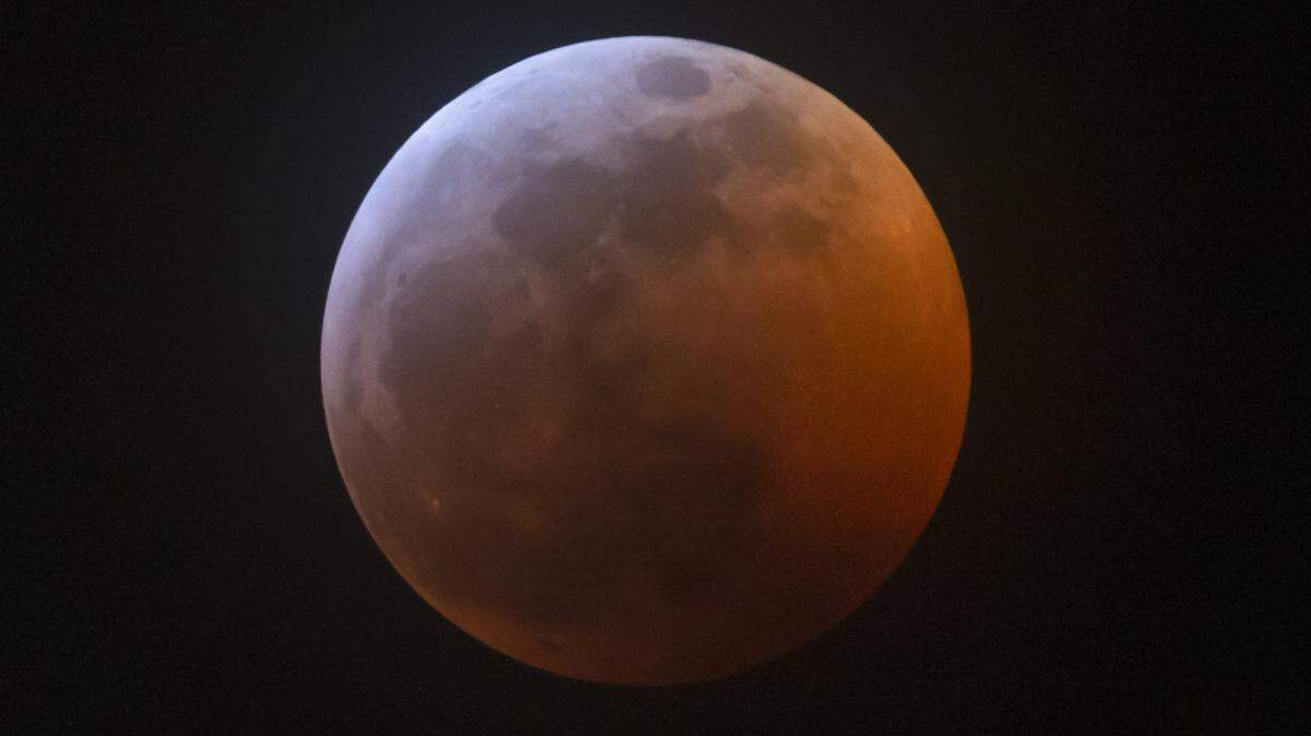The moon goes into full lunar eclipse in January 2019. Tuesday’s moon will feature a partial lunar eclipse.