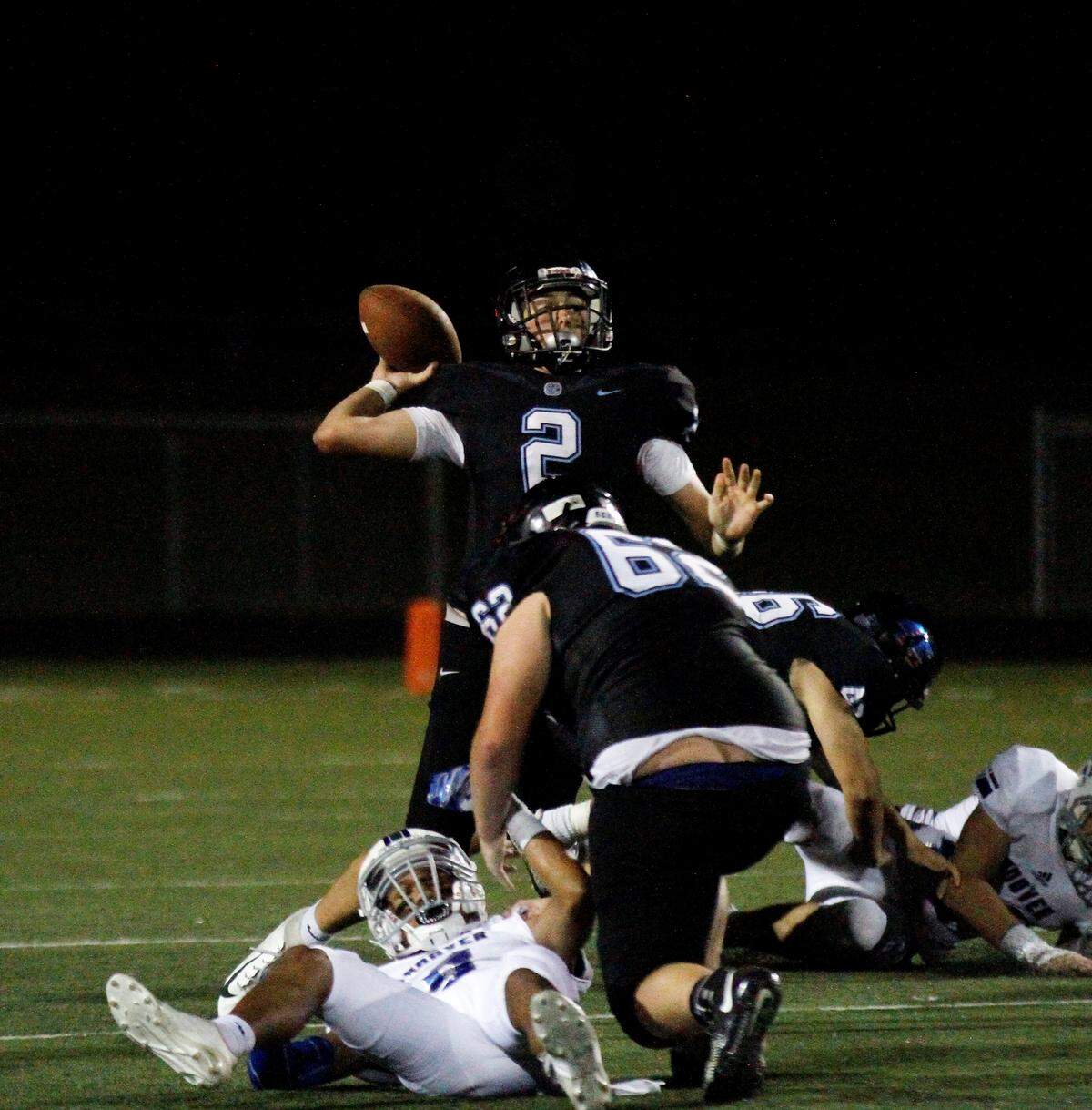 Goddard Eisenhower sophomore quarterback Nick Hogan looks deep during the Tigers’ 30-22 loss to Andover on Thursday night. (Sept. 13, 2018)