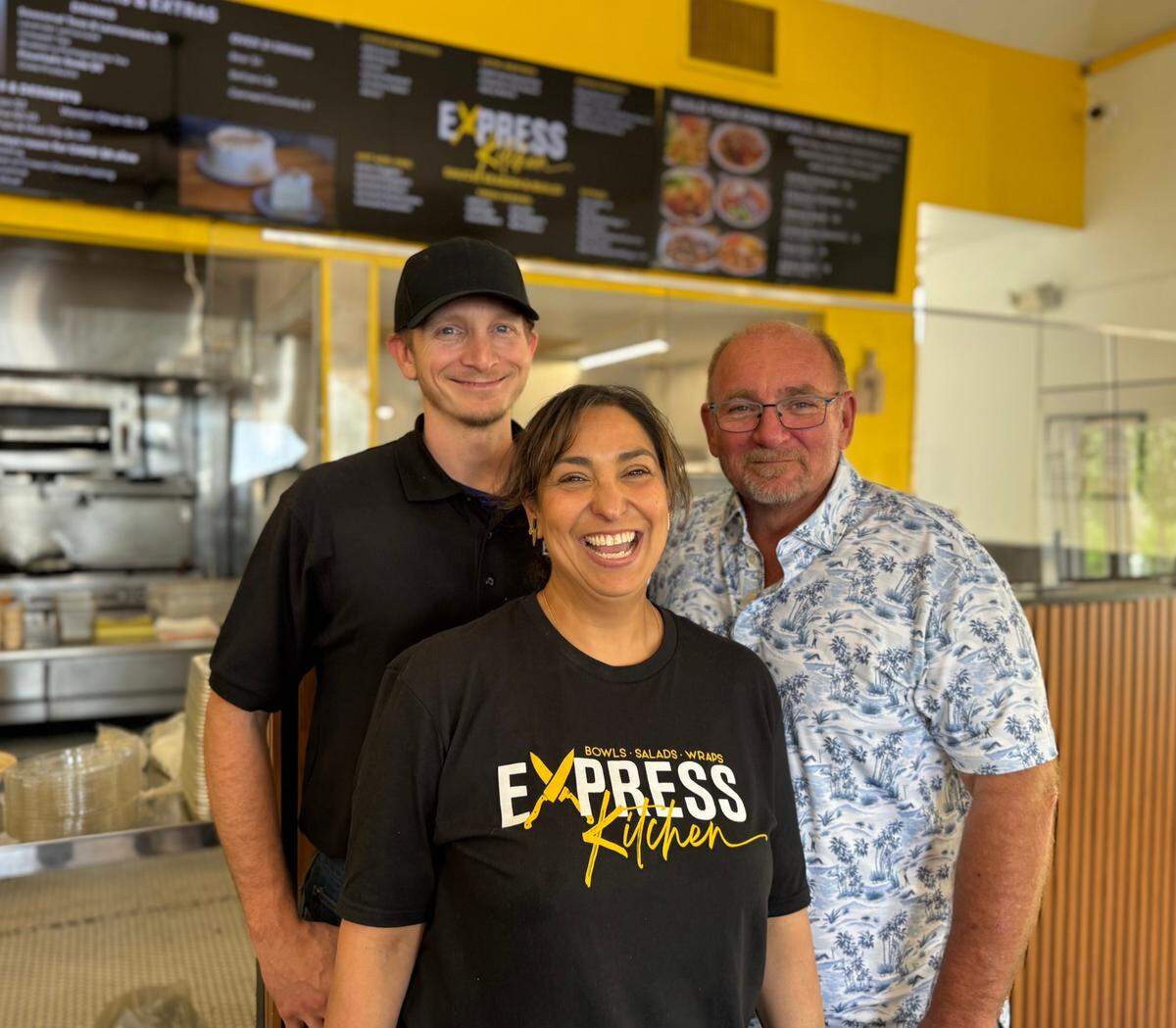 Express Kitchen’s owners are Natasha Gandhi-Rue, center, and Scott Rue, far right. It will be run by Rue’s son, Kristopher Rue, left.
