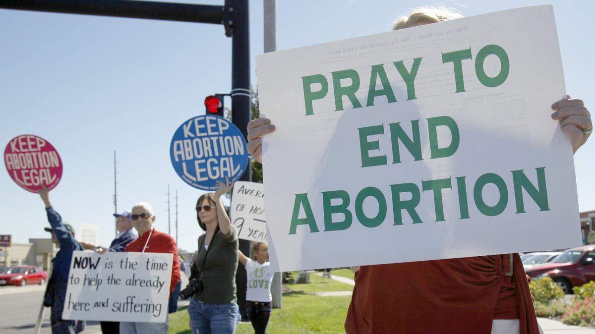 Abortion supporters and opponents protest in 2010.