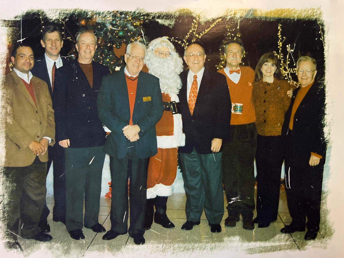 Jim Rhatigan was always in holiday photos with the executive team at Wichita State University. You just couldn’t necessarily tell it was him since he always played Santa.