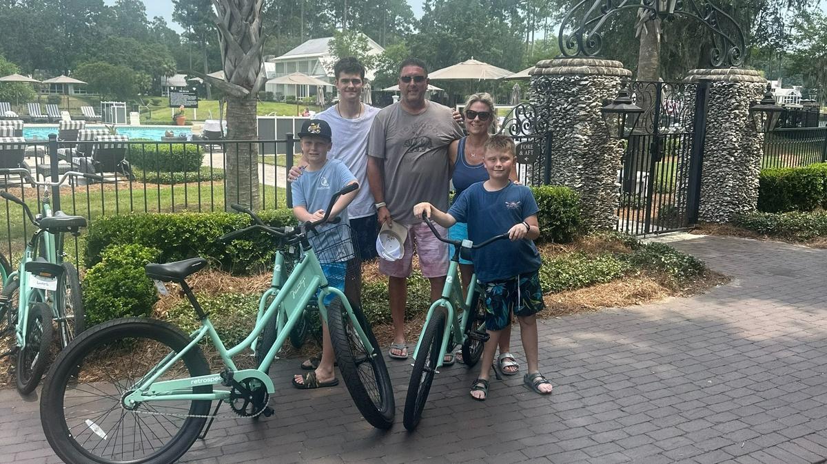 Jill Hattan and her husband, Ben, center, are opening Point Nine in Andover as a place for families and outdoors enthusiasts to gather when visiting the Redbud Trail. Also pictured are their children, from left, Morgan, Elliot and Riley.