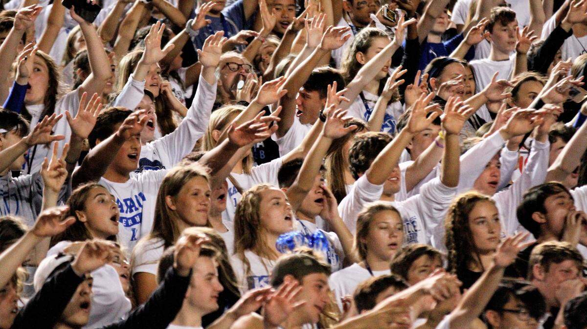The Kapaun student section gets rowdy during the 2018 Holy War against Bishop Carroll.