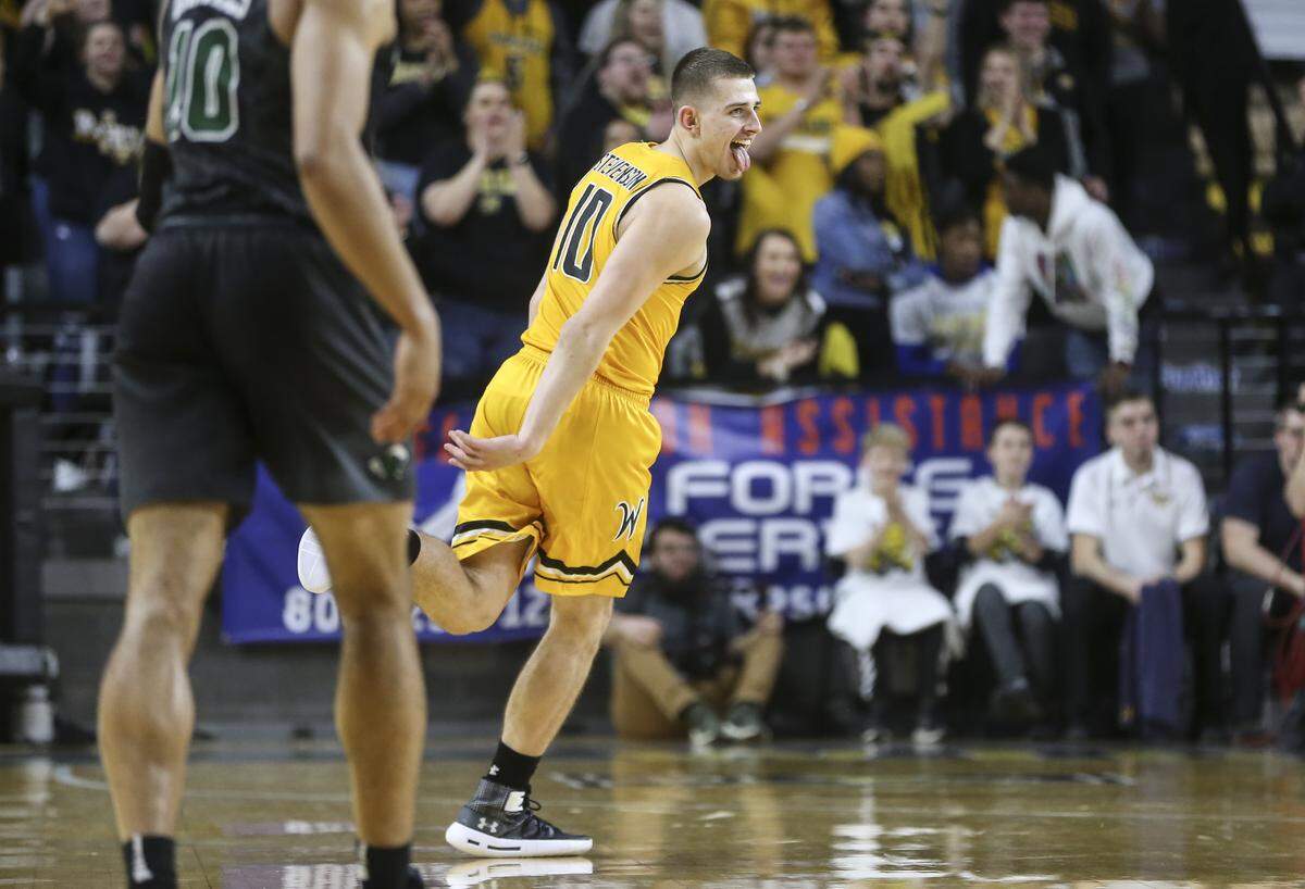 Wichita State guard Erik Stevenson celebrates a three-pointer during the second half of their game against Tulane at Koch Arena on Saturday. 
