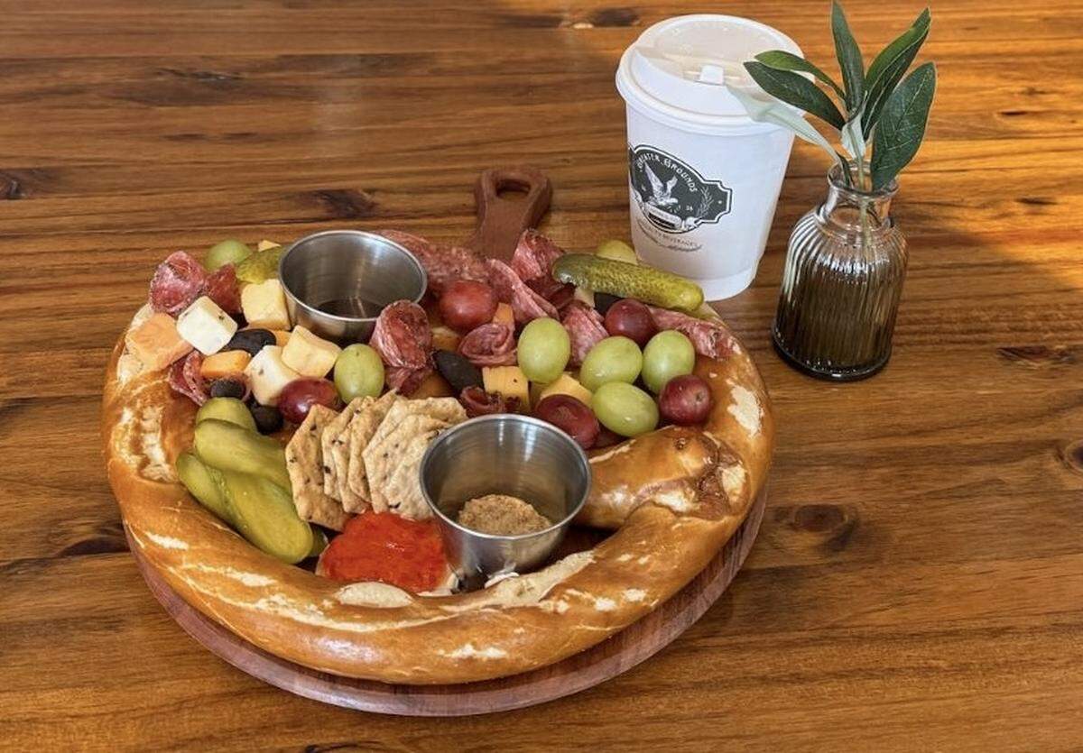 The Greater Grounds Coffee & Co. menu includes “The Great Charcuterie Pretzel,” a jumbo pretzel serves surrounded with meats, cheeses and jelly.