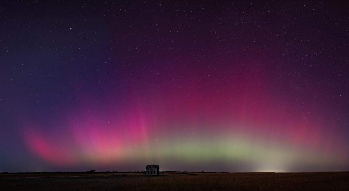 The northern lights can be seen above a dilapidated farmhouse near Marquette on Thursday night. The lights are caused by an interaction between the earth’s magnetic field and charged particles released by the sun.