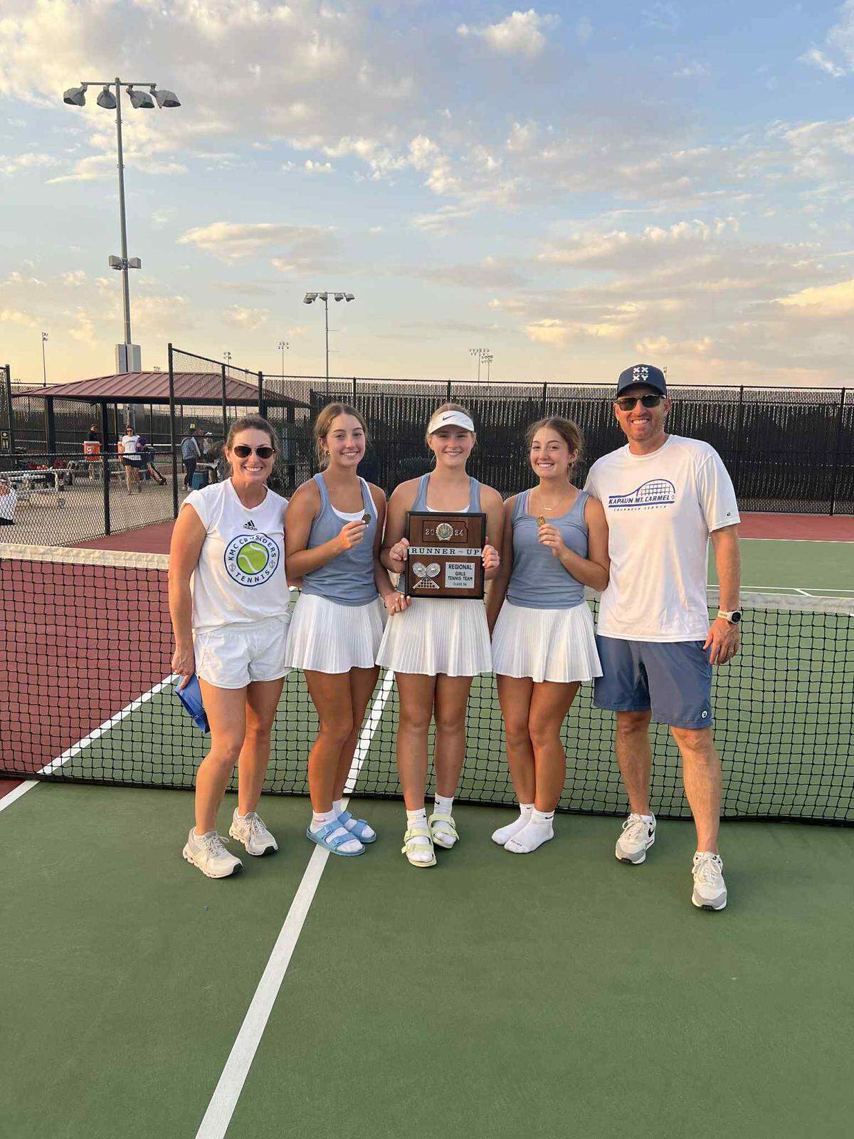 The Hocker family poses for a picture after a Kapaun Mt. Carmel girls tennis meet. From left to right: Laura, Caroline , Clara, Chloe and Jake.