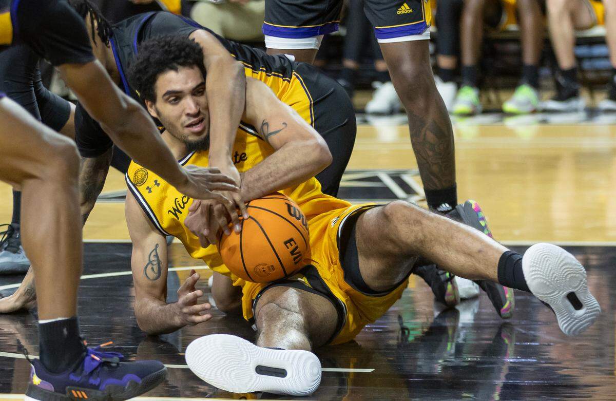 Wichita State’s James Rojas tries to get control of a loose ball during the second half against East Carolina on Saturday at Koch Arena.
