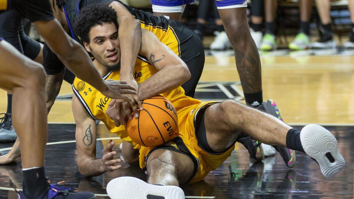Wichita State’s James Rojas tries to get control of a loose ball during the second half against East Carolina on Saturday at Koch Arena.