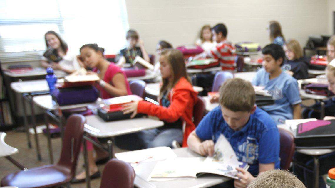 FILE  Maize Middle School South sixth-grade students read during class.