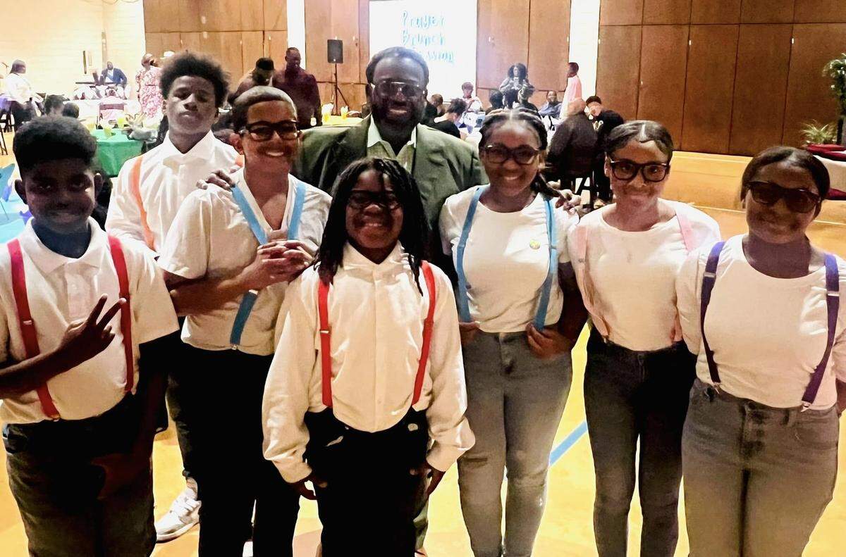 Bishop Mark Gilkey always took time to speak with children, including these young servers.