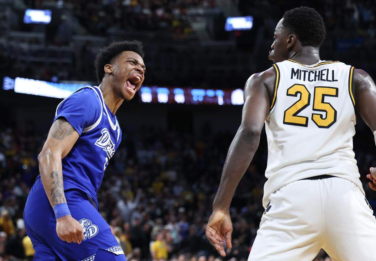 Drake guard Tavion Banks yells at Missouri’s Mark Mitchell after a dunk late in their NCAA Tournament game in Wichita on Thursday, March 20, 2025.