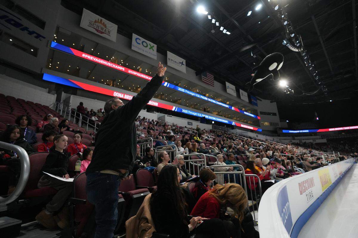 A fan throws a Shamu stuffed animal after a performance at the ice dance rhythm dance competition at the U.S. figure skating championships at Intrust Bank Arena.