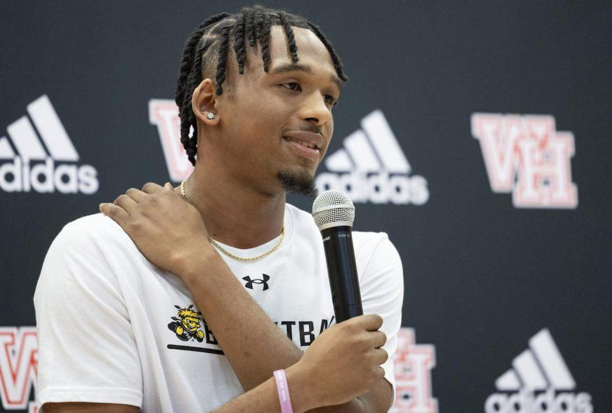 Wichita Heights senior basketball player T.J. Williams signed his letter of intent to play for the Wichita State Shockers on Wednesday.