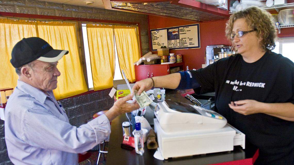 Nancy Parish, right, is pictured in 2001 as her restaurant in Maize was closing. She’s the inventor of The Artichoke’s famous sandwich menu.