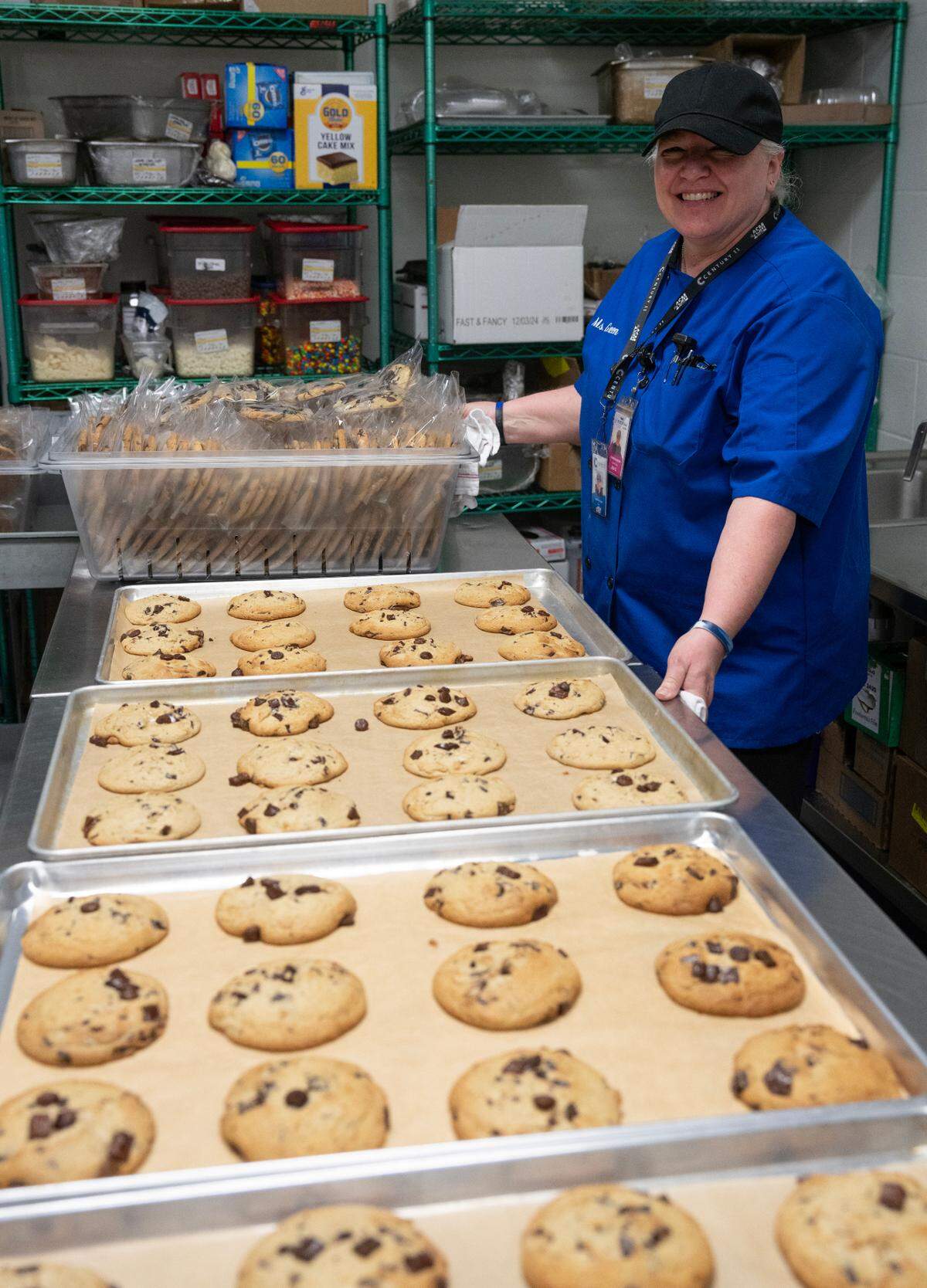 Cynthia Green will bake 100 dozen cookies and 160 dozen brownies for the NCAA Basketball Tournament at INTRUST Bank Arena.