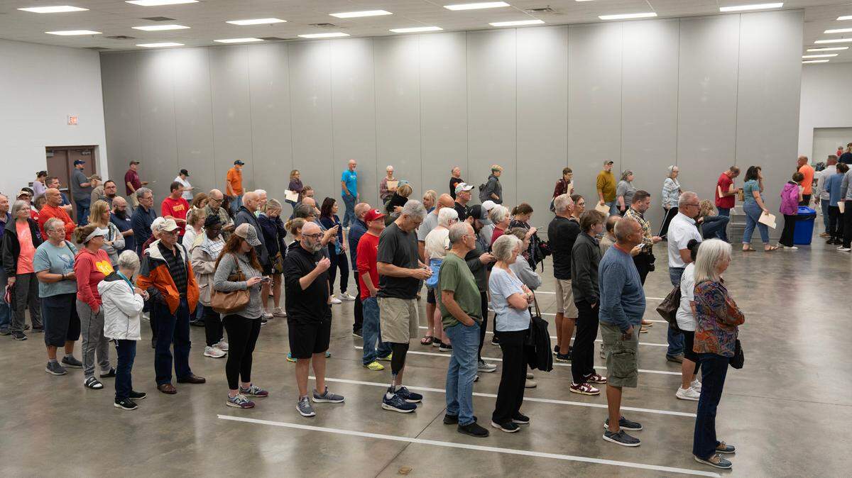 Early voters wait in line at the Sedgwick County Extension Center on Wednesday.