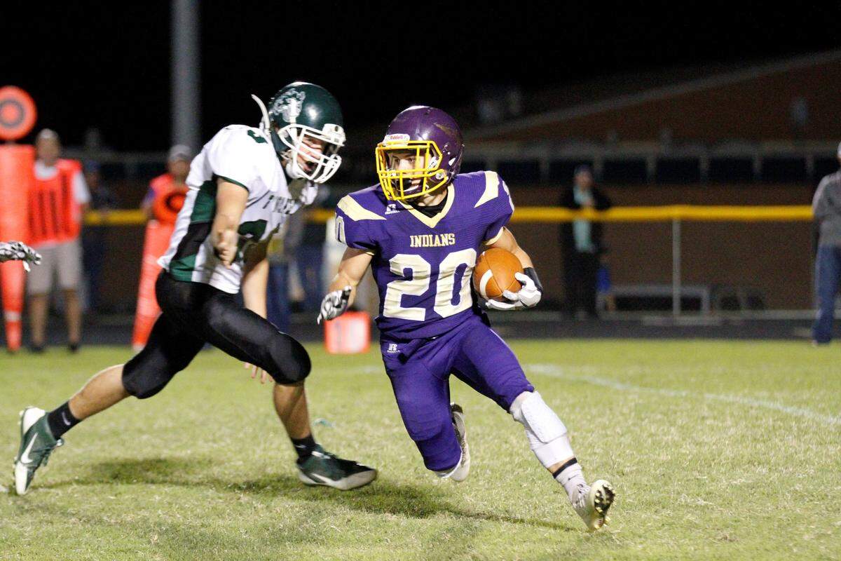 Medicine Lodge senior receiver Dakota Bayliff blows past a South Central tackler on Thursday night. (Sept. 27, 2018)