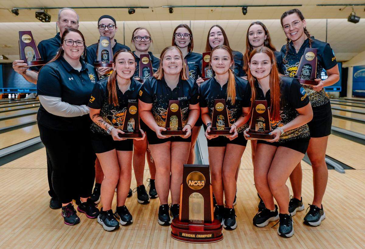 The Wichita State women’s bowling team pose with the Lansing Regional championship this past Saturday after punching their ticket to the Final Four of the NCAA Tournament.