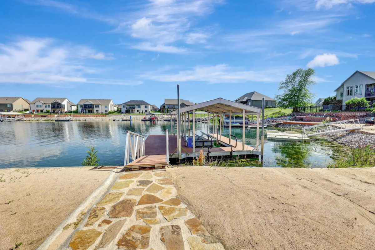 The dock view from 2612 N. Paradise Court, a waterfront Wichita property listed for $1 million.