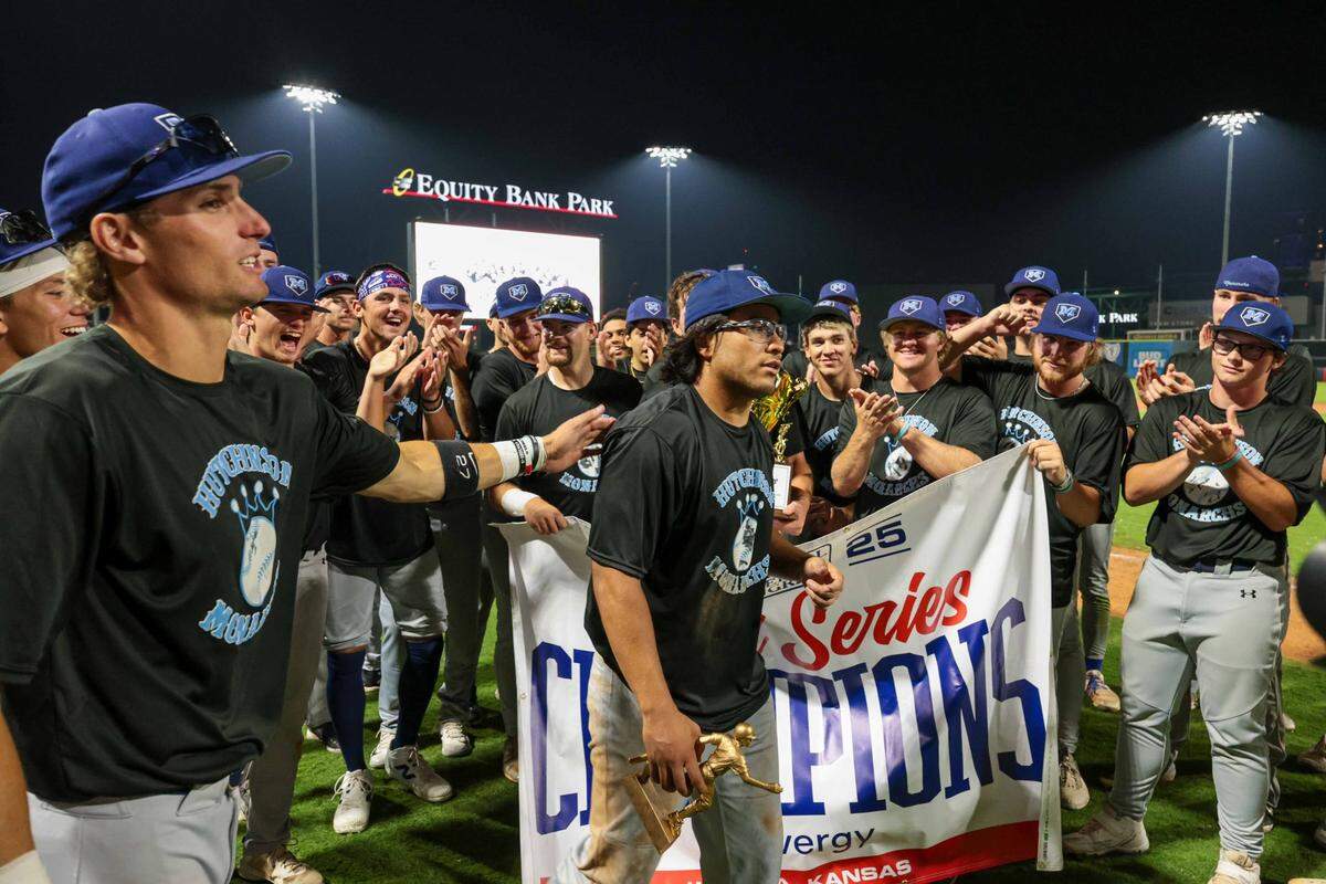 Future Wichita State player Drew Bugner (left) congratulates fellow future Shocker Jake Gutierrez after winning MVP honors in the NBC World Series. The duo helped the Hutchinson Monarchs win their second trophy in the last three years.