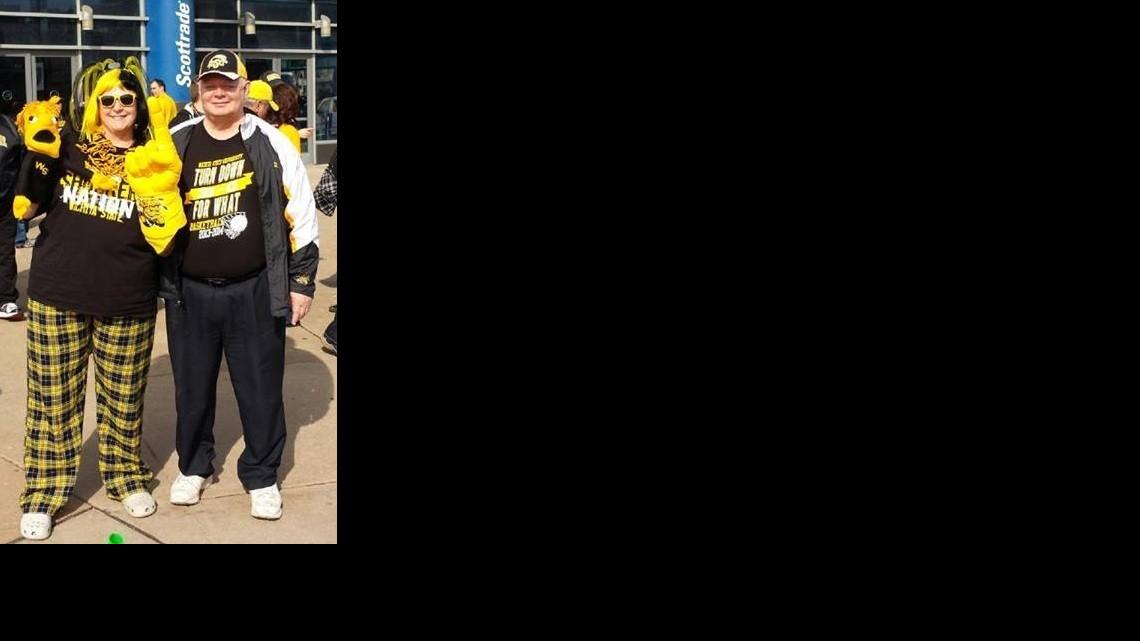 Former Kansas Republican Rep. Brenda Landwehr, left, pictured with her husband, David, took her We Wu puppet to St. Louis last weekend for the Missouri Valley Conference tournament – and even got him on the scoreboard during a break.

