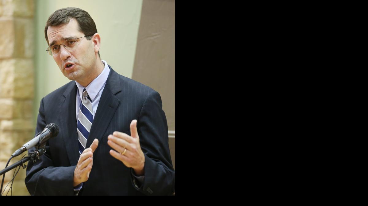 
Kansas Attorney General Derek Schmidt addresses the media Thursday at the Catholic Care Center on proposed legislation for the 2014 legislative session on protecting seniors against scams.
