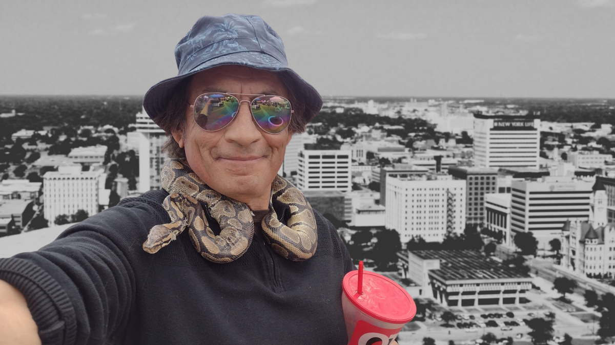 James Rangel Jr. took this selfie with his pet snake, Maximus the Magnificent, and his ever-present QuikTrip cup, and later the photo was superimposed over a picture of the skyline of Wichita.