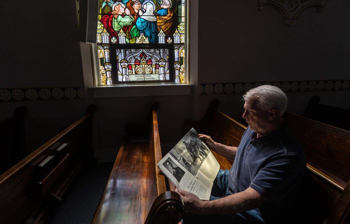 Ray Kapaun reads Mike Dowe’s Saturday Evening Post article about Father Emil Kapaun, while sitting in the church in Pilsen where his uncle was once the pastor.