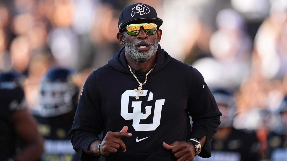 Colorado Buffaloes head coach Deion Sanders runs onto the field before the game against the North Dakota State Bison at Folsom Field.