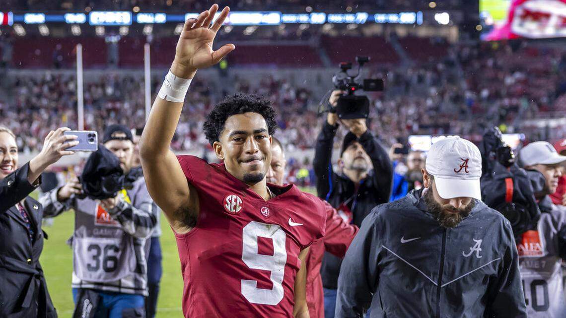 Alabama quarterback Bryce Young (9) salutes the fans as he leaves the field following an NCAA college football game against Auburn, Saturday, Nov. 26, 2022, in Tuscaloosa, Ala. (AP Photo/Vasha Hunt)