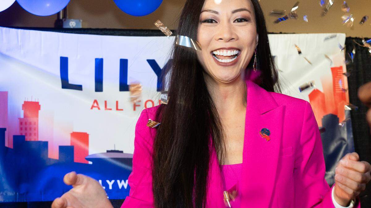 Confetti is tossed on Lily Wu before she delivered a speech to a large crowd of supporters at Doma restaurant after defeating incumbent Brandon Whipple.