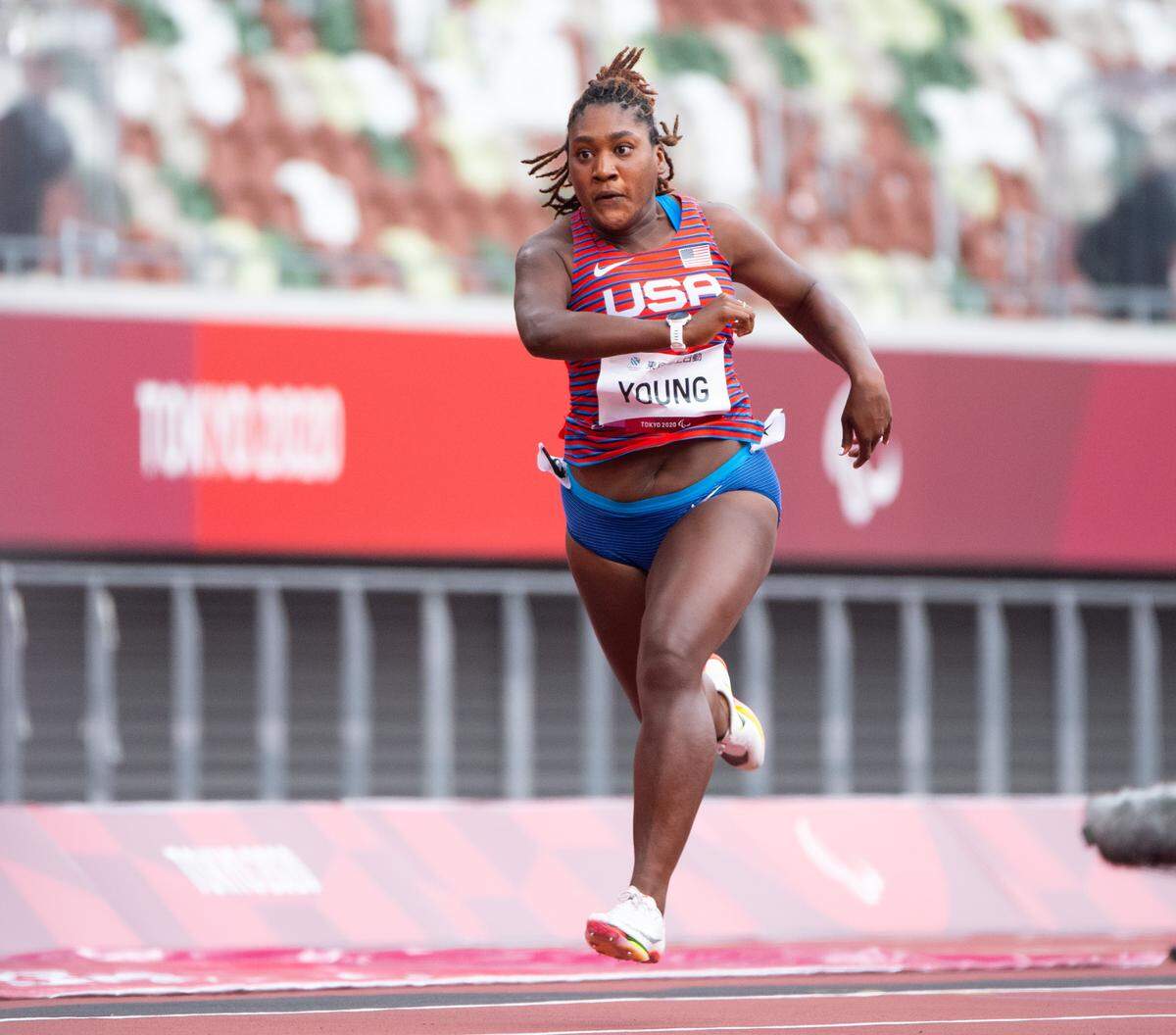 Deja Young competes for Team USA at the T47 100-meter dash on Tuesday at the Tokyo Paralympic Games.