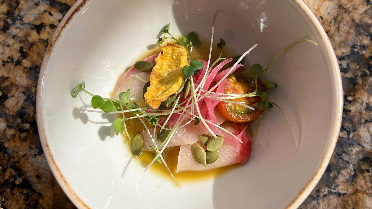 One of the new dishes on the Doma brunch menu: yellow tail aguachile topped with pickled onions, heirloom tomato, dried pineapple, micro greens and pepitas