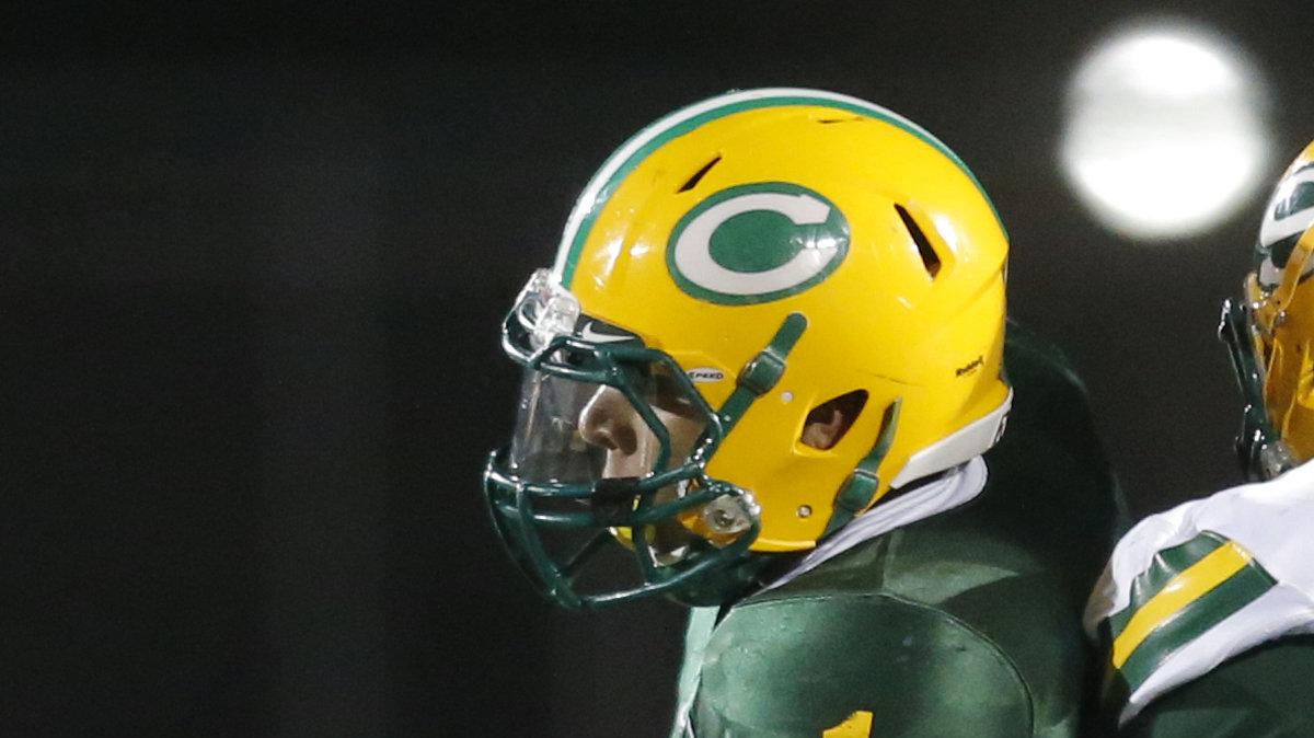 Bishop Carroll's Denzel Goolsby (1) pulls in a pass against Salina South's Aaron Mar for a first down in the second quarter  at Bishop Carroll High Friday night. (Nov. 15, 2013)