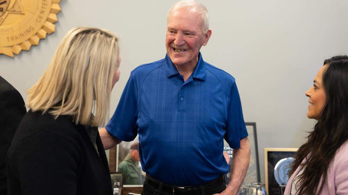 Robert “Bob” Bachman is congratulated at a party to mark his retirement from the Wichita Police Department after 43 years.