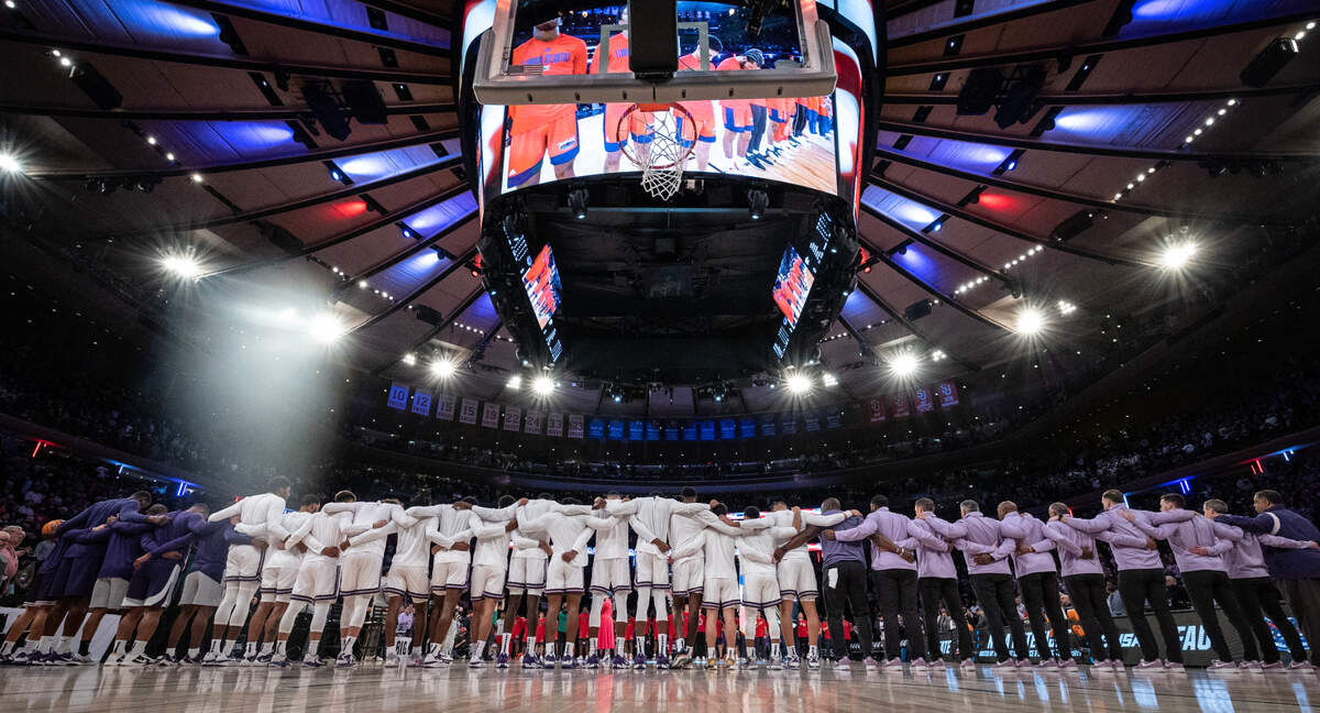 The Kansas State men’s basketball team stands for the national anthem before their east region final game against Florida Atlantic at Madison Square Garden on Saturday night.