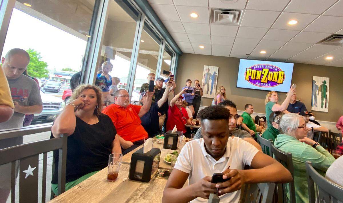 People packed into a room at Pizza Ranch and several more pressed their faces against the windows outside to watch Randy Santel take on his first Wichita eating challenge.