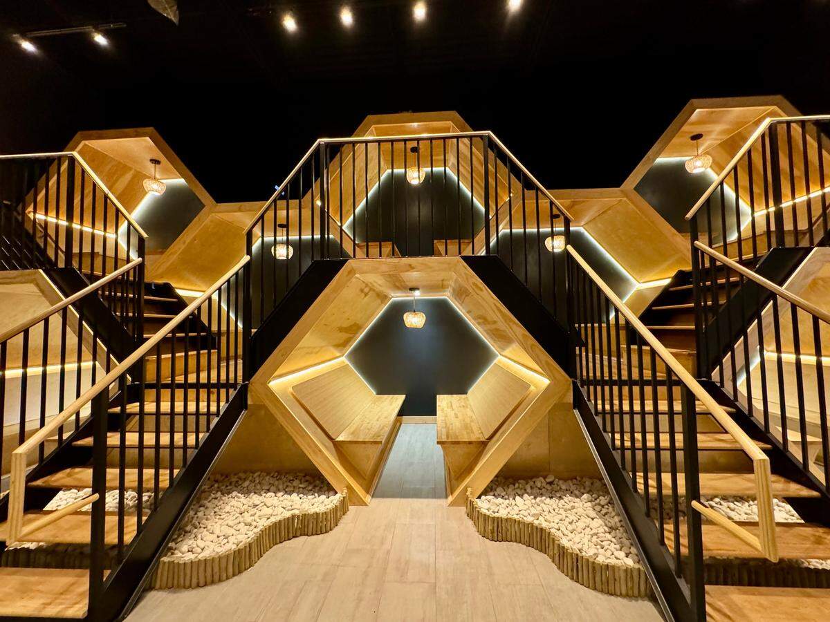 A unique honeycomb tiered booth setup is the centerpiece of Kyuramen restaurants across the country.